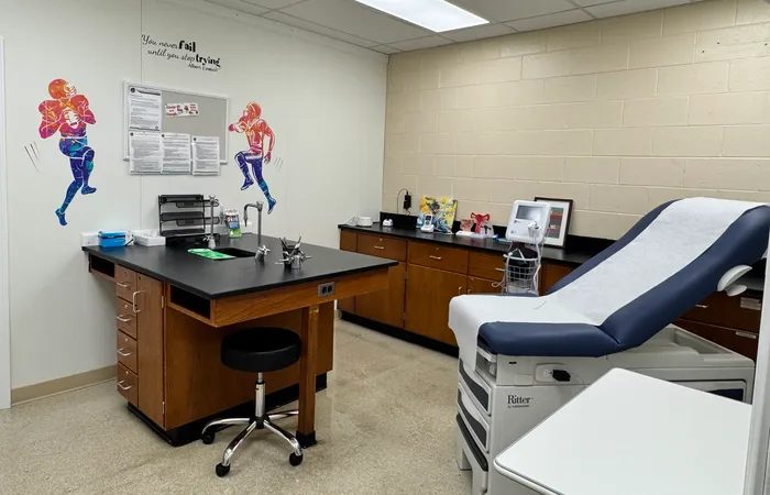 Starbiz cleaner disinfecting an exam room surface at a Sandy Springs medical practice