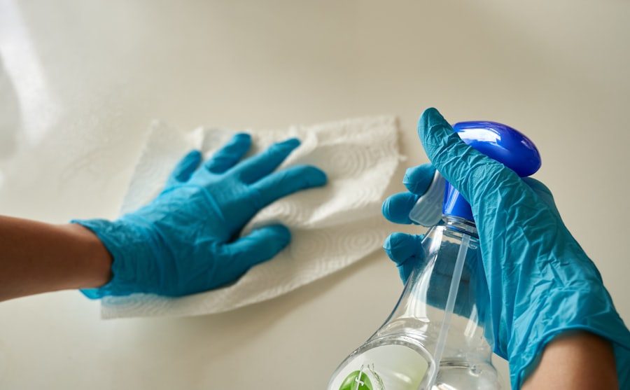 Gloved hands wiping down a surface during a detailed deep clean