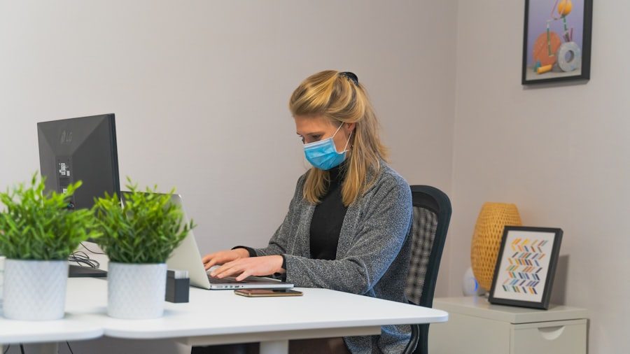 Gloved hands disinfecting a high-touch office surface during flu season