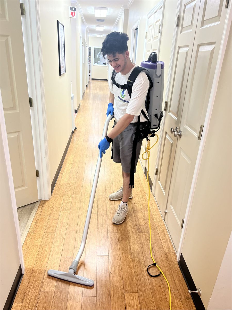 Starbiz cleaner sanitizing a commercial restroom